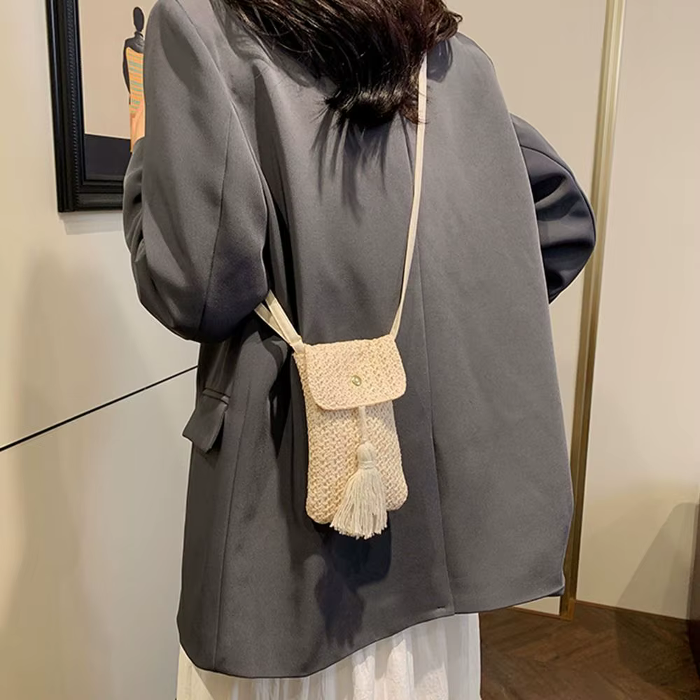 Sac à main portable en paille tressée avec longue pampille, pochette pour téléphone faite à la main pour femme, design de niche, style coréen, sac de plage tressé pour l'extérieur
