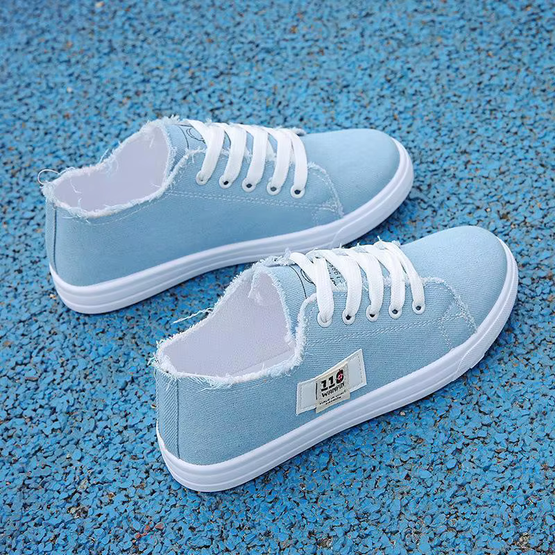 Nouvelles chaussures plates décontractées confortables en toile blanches à lacets croisés légères pour femmes